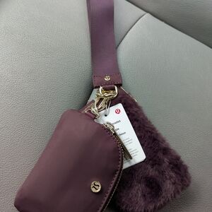 Lululemon Athletica Plum Wristlet with Faux Fur